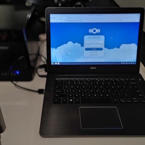 Old Dell Vostro with 5-bay SATA dock, running Nextcloud server stack.