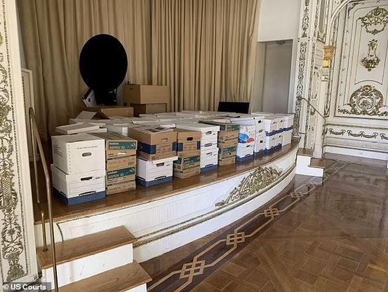 Dozens of boxes of classified docs simply left on a stage in an unlocked room in Maralago.