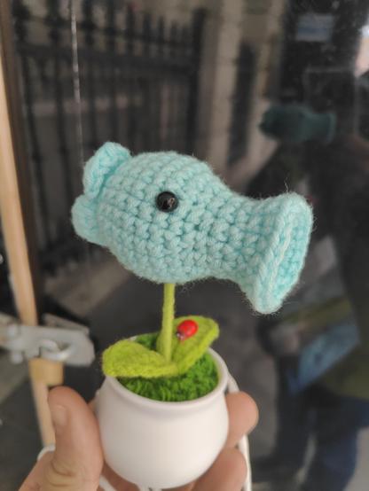 A blue peashooter-style plant