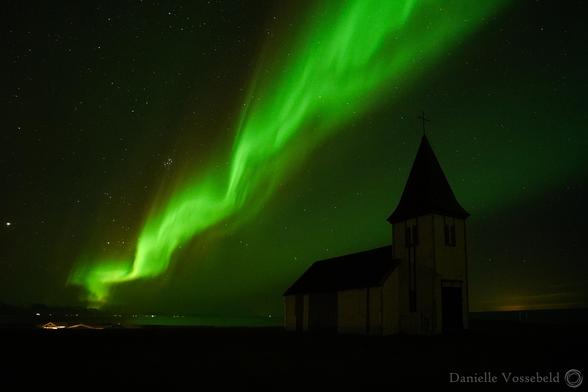 Strong green veil of lights over the church