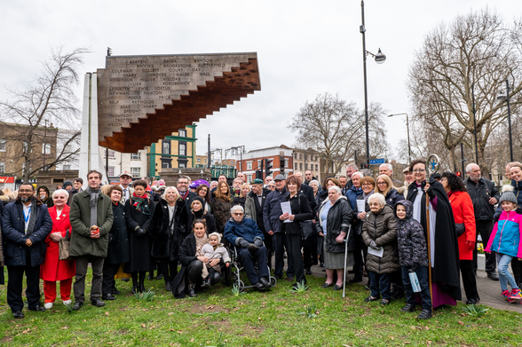 Group photo after the service at the memorial 5.3.23 outside Bethnal Green Tube station 

Photo from Stairway To Heaven memorial web site 