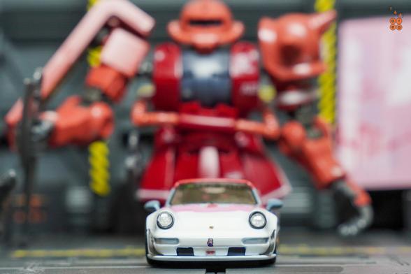 A front side of Porsche RWB 964 Akiba by RWB Official in 1:64 scale with 1:64 figure on AREA 164
