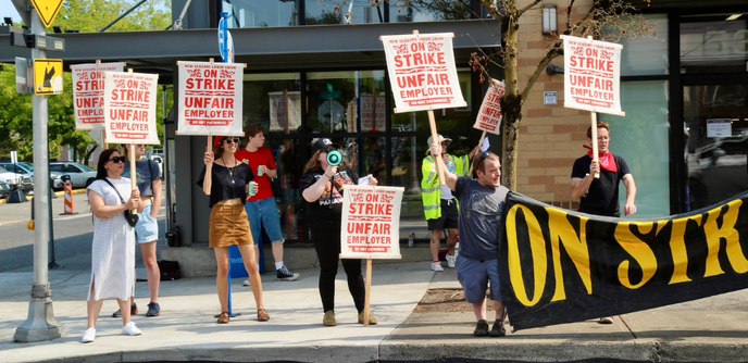 
Portland Grocery Workers strike 

Over Labor Day weekend, 5,500 grocery workers in Portland went on strike across two unions: the independent New Seasons Labor Union (pictured), which is seeking a first contract at a local natural foods chain, and UFCW Local 555 at Fred Meyer, a supermarket-department store chain owned by the corporate giant Kroger. 

Photo: NSLU members hold “On Strike Unfair Employer” signs and a ON STRIKE Banner outside a store in Portland 

Source New Seasons Labor Union 
https://www.nslu.org/
