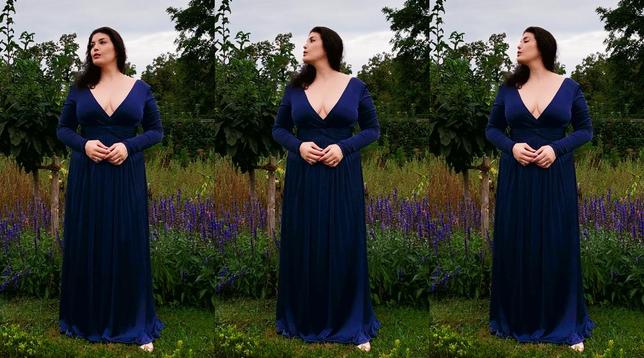 Three full-length portraits of a woman with long dark hair and red lipstick, side by side with slight differences in her pose. Wearing a deep blue dress with long sleeves and a plunging neckline, she stands with her hands loosely clasped at waist level in a lush garden in front of purple flowers, with a young fruit tree to her left behind her and a cloudy sky in the background. In the left version she is looking slightly to the right, in the middle version she is looking to the right towards the sky in profile, her head tilted slightly back as if in thought, in the version on the right her head is in the same position, but with her eyes closed.

Soprano Megan Marie Hart in the Prinz-Georg-Garten in Darmstadt, Germany, September 2024. Photos: Stefan Romero Grieser, CC BY-SA 4.0