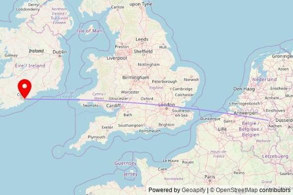 A map showing the great circle route from Maaseik in Belgium to a map pin at St.Colman's Cathedral, Roches Row, Cobh, County Cork, Ireland