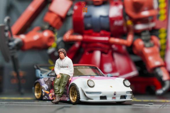 A male lean on Porsche RWB 964 Akiba by RWB Official in 1:64 scale with 1:64 figures on AREA 164