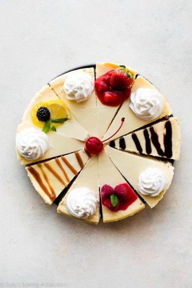 A delightful image of 10 different slices of cheesecake including ones with carmel and chocolate sauce drizzled on top & others served with whipped cream and raspberry sauce.