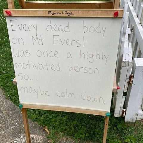 Whiteboard with the message: 

"Every dead body on Mt. Everest was once a highly motivated person so... maybe calm down."

