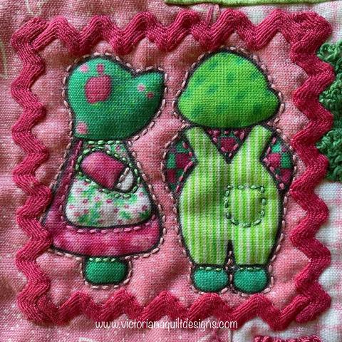 Small quilt block with Sunbonnet Sue & Overall Bill. 
