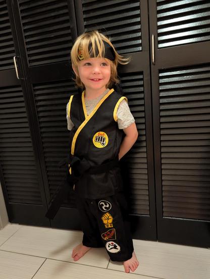 PJ dressed as Johnny Lawrence from Cobra Kai.