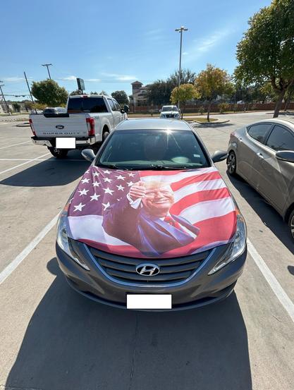 A hood wrap showing Donald Trump giving a thumbs up.