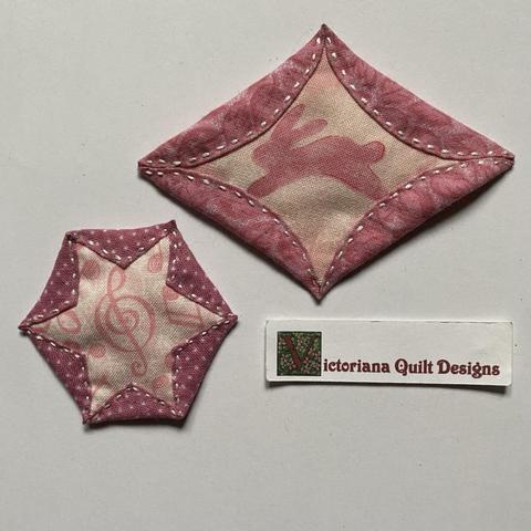 Two pink fabric pieces. 