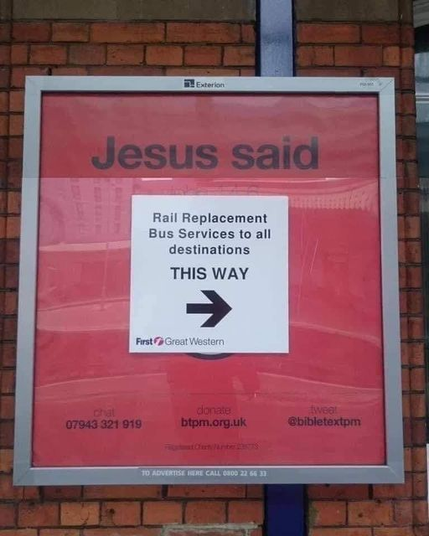 poster that has the headline "Jesus said", a piece of paper with the words "rail replacement buses this way" is stuck over the part that was going to tell us what Jesus said.