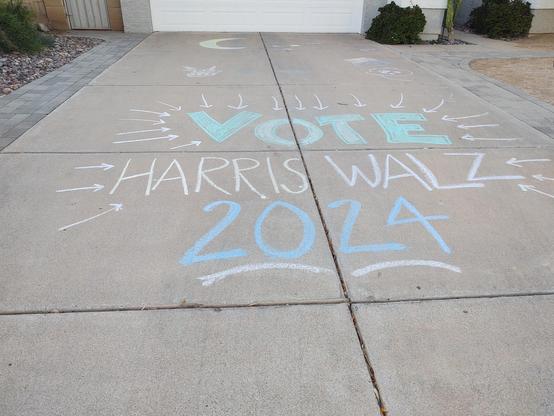 Chalk art saying to vote Harris Walz in 2024