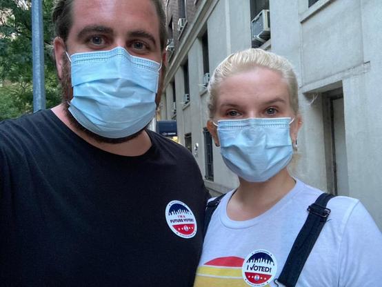me and my partner in 2020, we both have masks on, I have a "I'm a future voter" sticker.