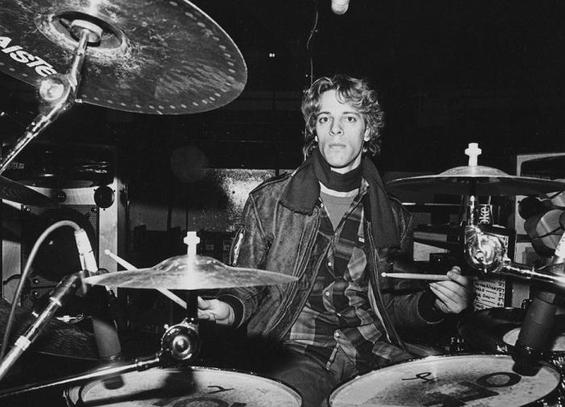Black and white photo of a young Stewart Copeland at his drum kit