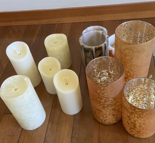 Candles and lanterns on a wooden floor
