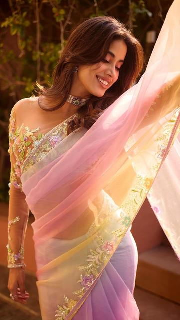 Experience timeless glamour as Janhvi Kapoor wows in a Manish Malhotra pink ombre saree. This stunning floral design highlights Janhvi’s radiant beauty, with intricate detailing that captures both sophistication and femininity. Perfect for any fashion enthusiast, this look blends modern elegance with traditional charm, proving Janhvi’s place as a style icon. Don’t miss out on Janhvi’s beautiful style moment and discover the inspiration behind her captivating saree look!