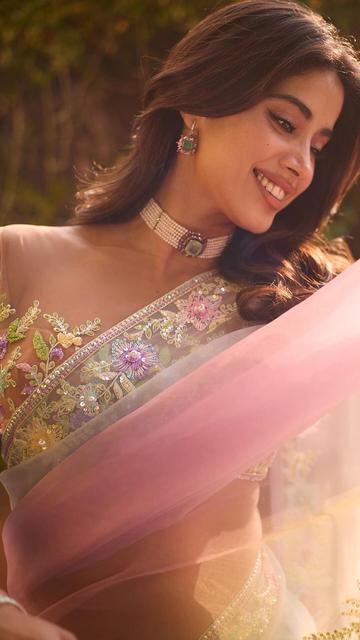 Janhvi Kapoor’s pink ombre saree look is a fashion dream brought to life! Designed by the iconic Manish Malhotra, this saree features breathtaking floral motifs that capture the essence of grace and elegance. With its stunning hues and flawless design, Janhvi’s outfit embodies beauty in every sense. Take a closer look at how Janhvi pairs traditional style with a modern twist, setting new standards in celebrity fashion!