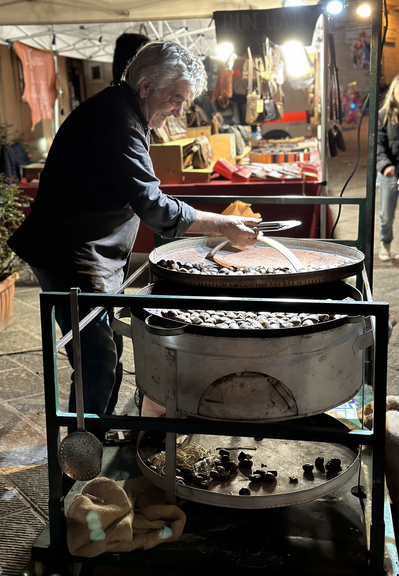 Man preparing roasted chestnuts 