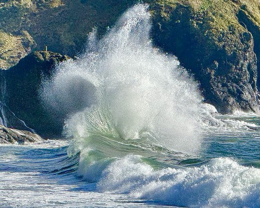 Large wave crashing on the rocky shore of Washington state on Monday 4 November 2024