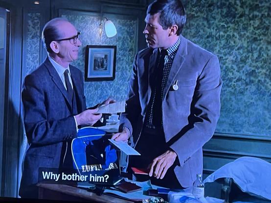 Ned Glass giving James Coburn a come hither look.