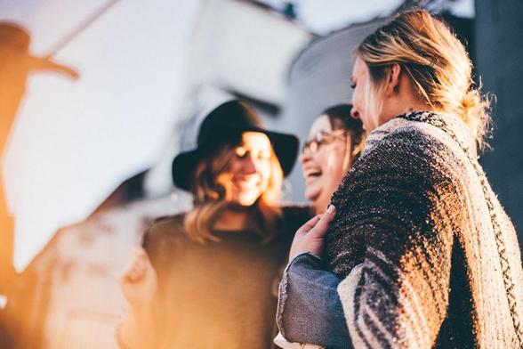 A group of women talking and laughing