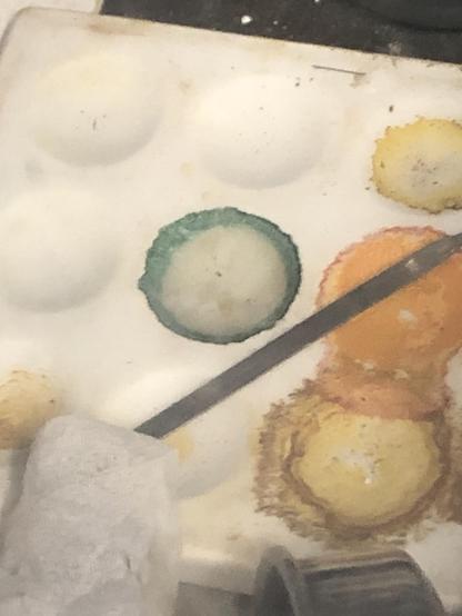 The green spot of Cp2TiCl2ZnCl2TiCp2 on a spotter plate next to orange spots from when the atmosphere was awful.