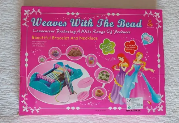 The box of a chinafake weaving and bead kit called "Weaves With The Bead".