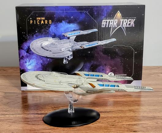 Photo of new Fanhome model of the USS Titan from Star Trek: Picard, with original box in the background.