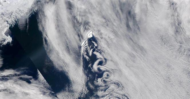 Satellite image of Jan Mayen with clouds forming von Kármán vortex street.