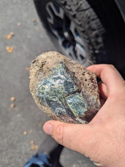 A rock that is either jadeite or jade