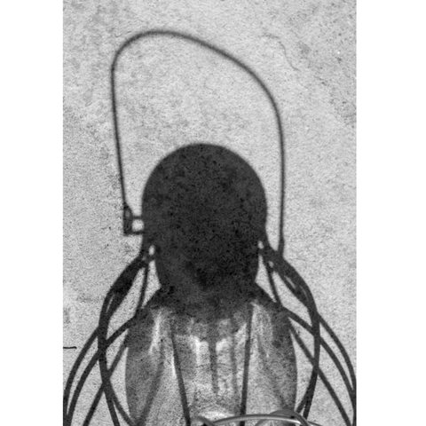Photo of a shadow cast on ground, by Lisa Kalloo