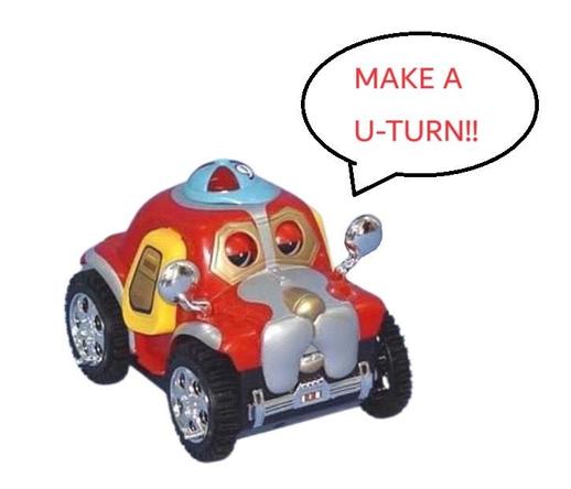 A bootleg tumbling car toy with a dog face. A speech bubble saying "MAKE A U-TURN!!" has been crudely added to the image, likely in Microsoft Paint.