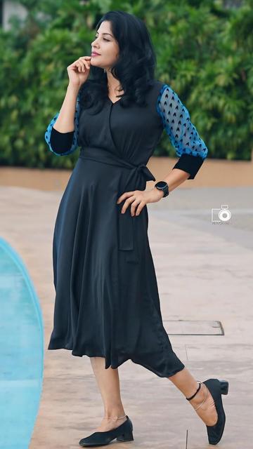 Elegance meets fashion in Shivada’s breathtaking flowy black dress. The outfit exudes timeless charm, redefining how black outfits can steal the spotlight in any event.