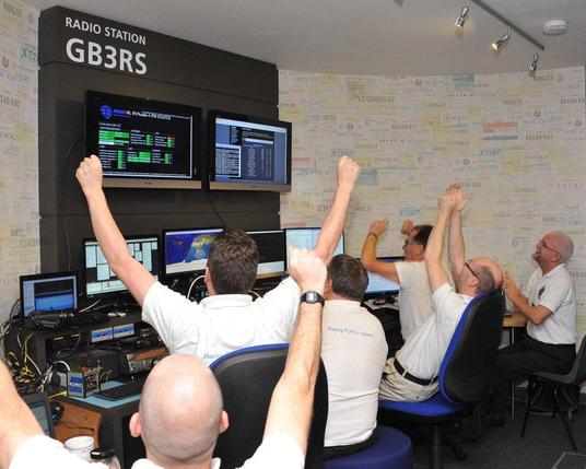 The team cheering when the first data gets in after launch at mission control at GB3RS Bletchley Park