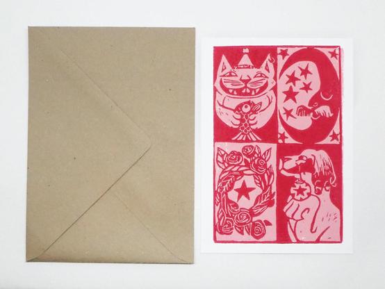 The hand printed lino cut card with on its left the envelope in recycled paper. 