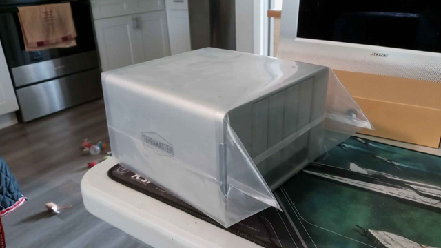 Side image of a Terramaster 4 Bay [white in color] NAS, showing it's size.