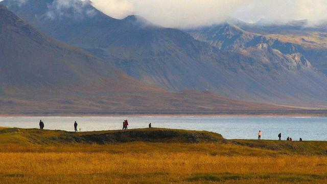 People standing on near shore.