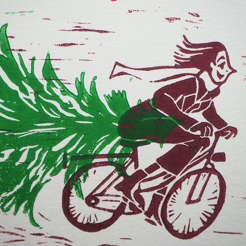 A detailed photo of the woman on his bicycle. 