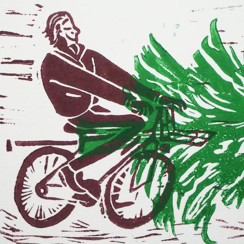 A detailed photo of the man on his bicycle. 