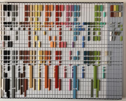 Large collection of Modulex bricks on a display board, organised by colour and brick size
