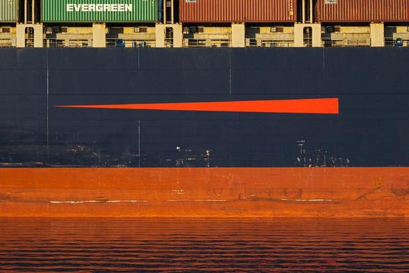 Colorful detail of side of container ship, with "Evergreen" container