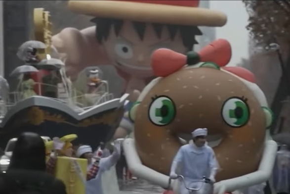 luffy balloon float with disney float and a donute