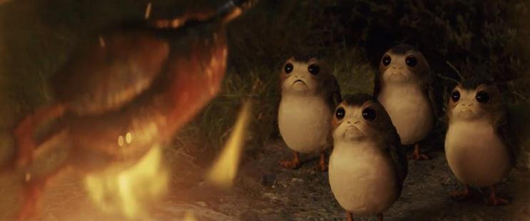 A scene from the movie The Last Jedi of a porg cooking next to other porgs