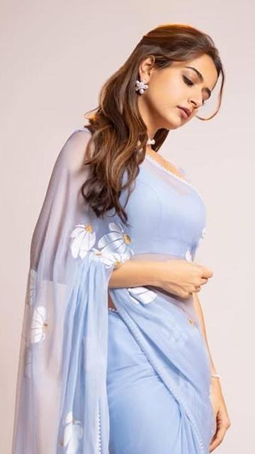 Ashika Ranganath's floral blue sheer saree at the trailer event is what fashion dreams are made of! The beautifully crafted saree highlighted her grace and elegance, making her a standout among celebrities. Her choice of this outfit showcases her love for chic and contemporary designs.