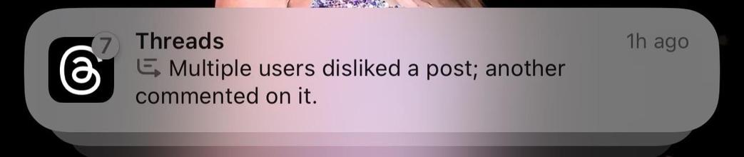Stack of 7 Threads Notifications on iOS 18.1. Summary reads “Multiple users disliked a post; another commented on it”