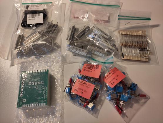 Pile of parts for building Apple II DuoDisk Floppy Emu adapters.
