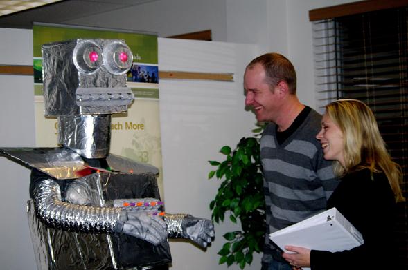 Two humans being consulted by consultatron