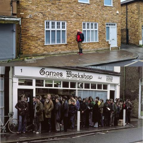 Top modernish yellowish brick (not road :) London house with pavement and bit of road in front of shot. House is 2 story with white window and door frames. Front centre is baldy beardy man in red jacket, greenish plus fours, black knee high socks, red and black sneakers, black backpack looking at camera smiling from November 2024 and juxtaposed with bottom with same location picture of people queing outside a shop, sign above shop says Games Workshop in gothicish font, a motley crew of mainly white males stands out the front stretching along the whole length of the shop April 1978